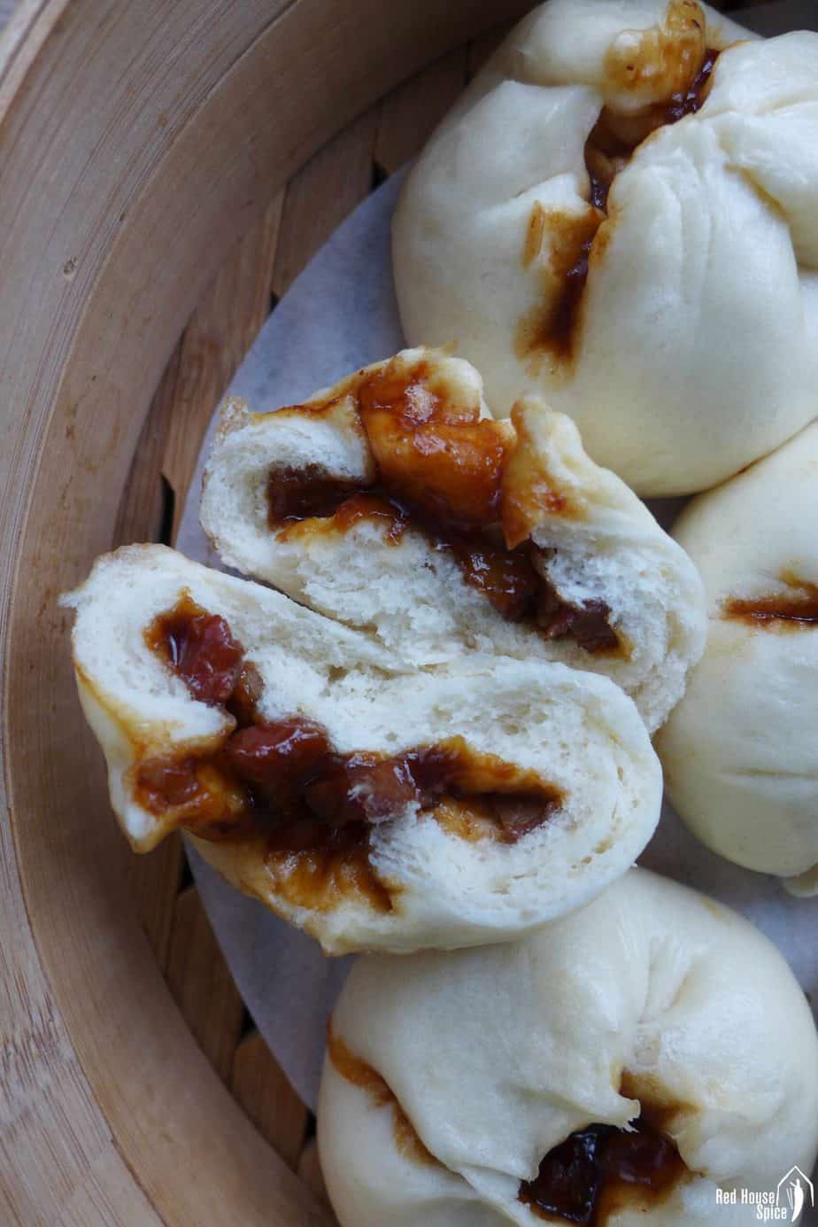 Char siu bao in a bamboo steamer