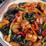 A plate of Chinese ginger chicken with overlay text that says Chinese ginger chicken