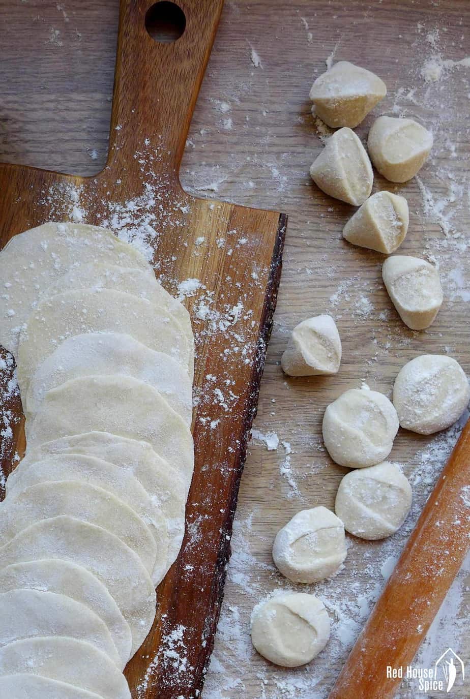 Freshly rolled dumpling wrappers and some dough pieces.
