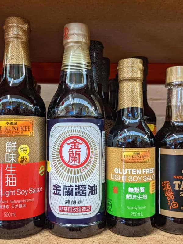 Three bottles of soy sauce and one bottle of tamari