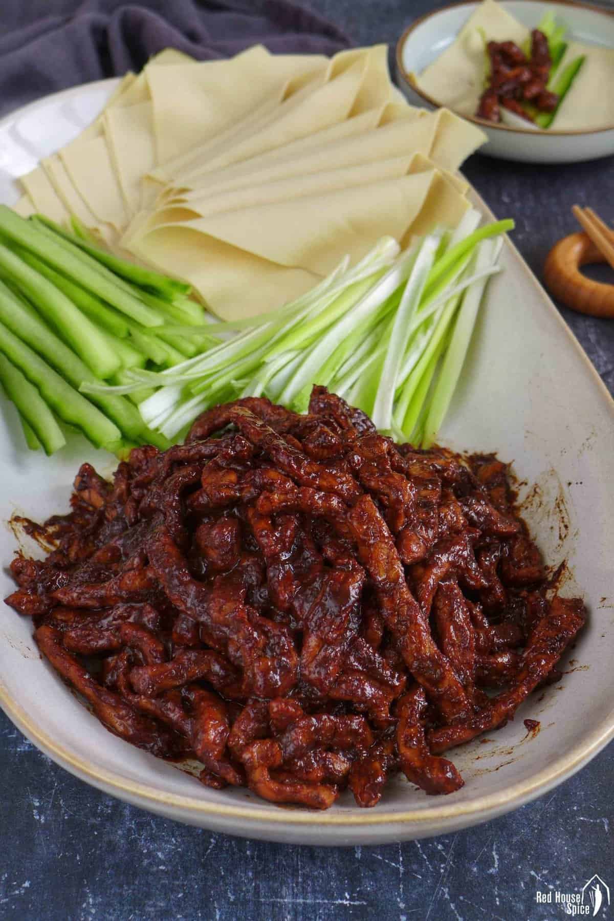 Peking shredded pork with tofu sheets, julienned scallions and cucumber
