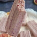 one red bean popsicle bitten on the top.